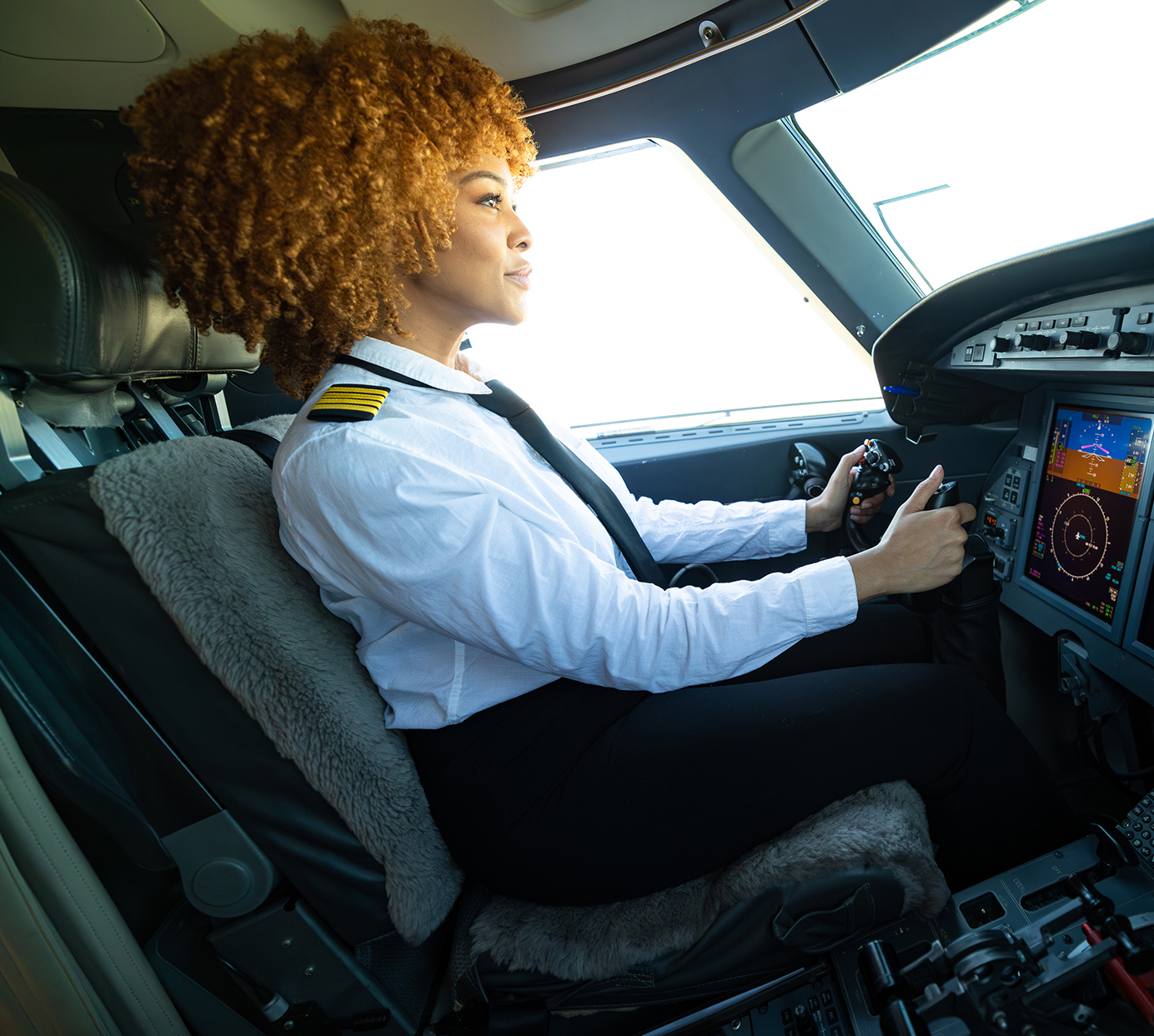 Female student flying an airplane